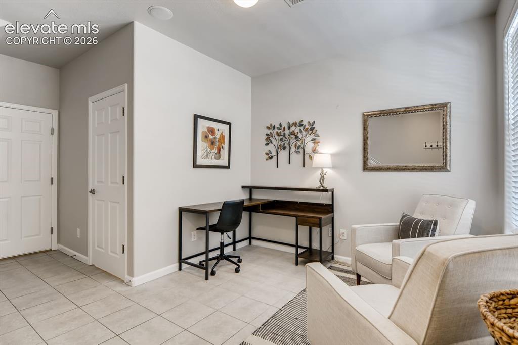 Image 20 of 23: Versatile room featuring tile flooring, neutral wall tones, and recessed li