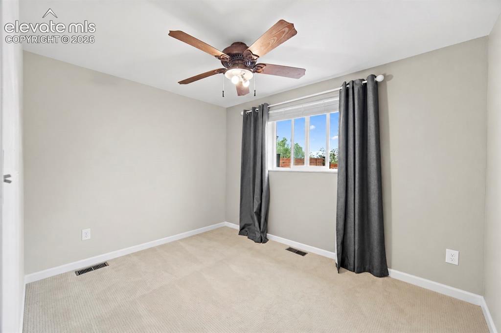 Image 25 of 49: Main level bedroom (virtually painted)