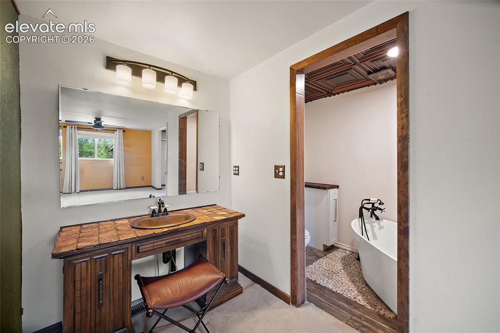 Image 32 of 49: Primary bathroom with soaking tub