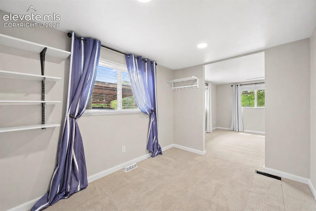 Image 35 of 49: Main level bedroom (virtually painted)