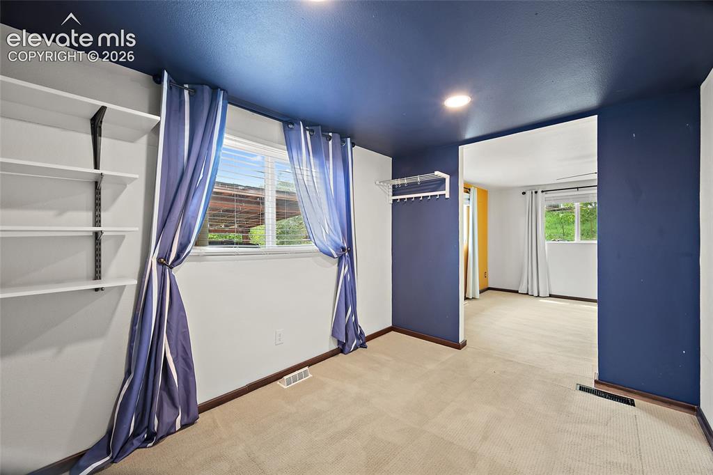 Image 36 of 49: Main level bedroom