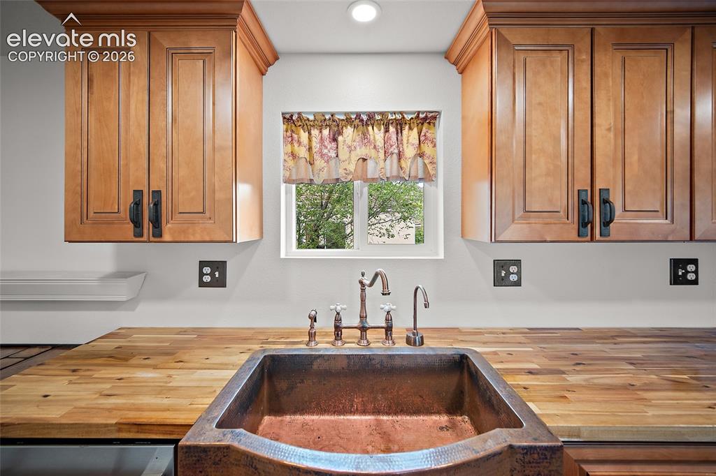 Image 5 of 49: Copper sink in updated kitchen 