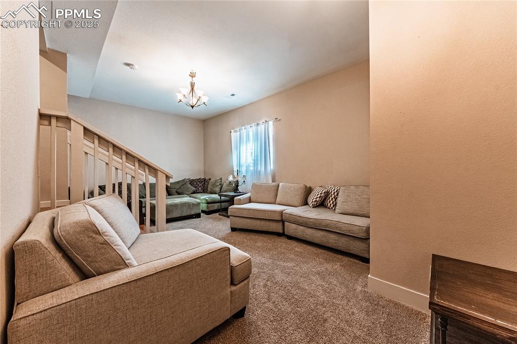 Image 18 of 45: Unit B - garden level with vaulted ceilings and natural light