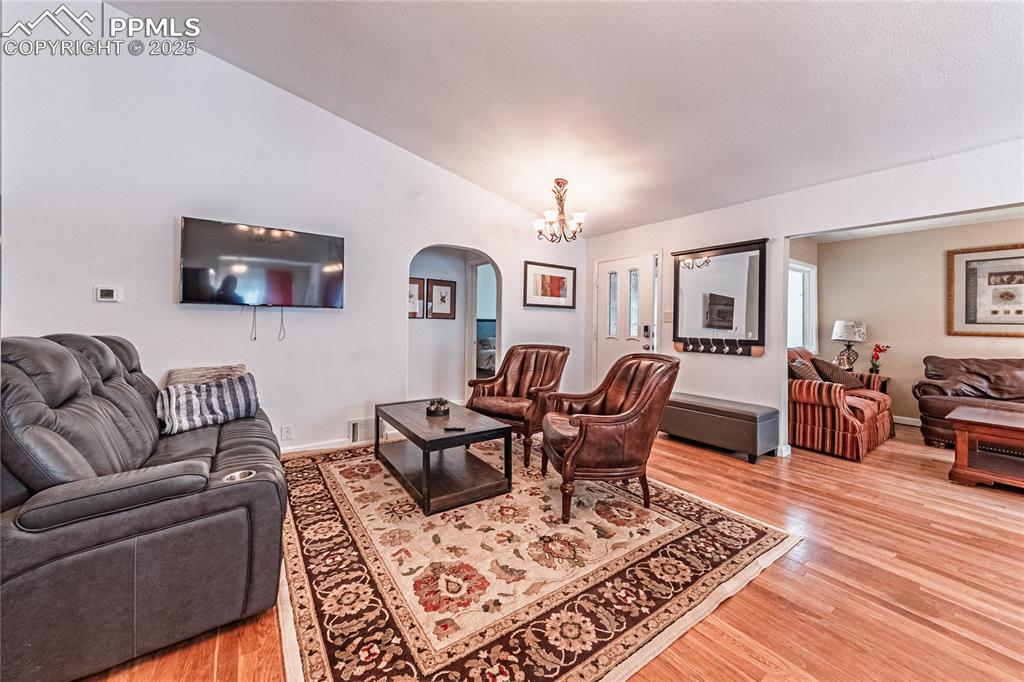 Image 26 of 45: Unit A - living room with vaulted ceilings