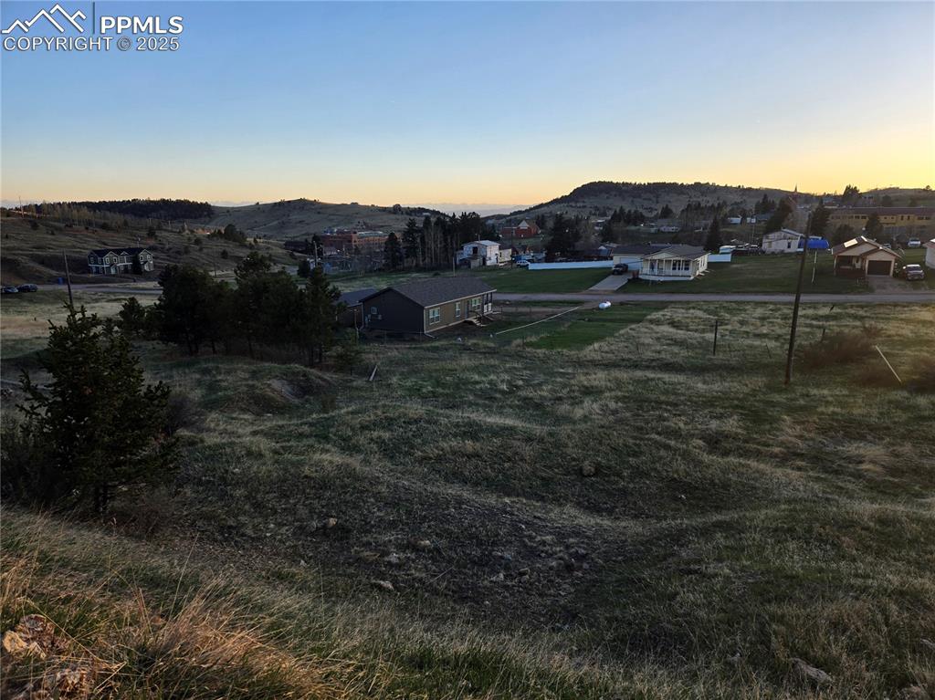 Image 5 of 10: View of yard featuring a mountain view