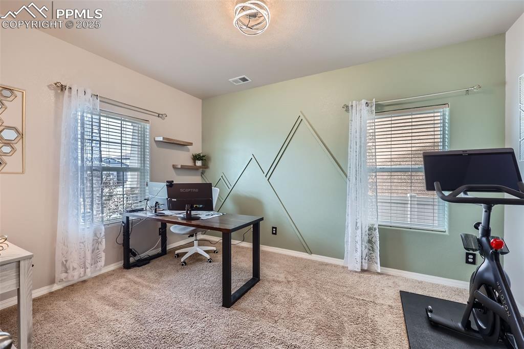 Image 12 of 29: Office area featuring carpet flooring and baseboards