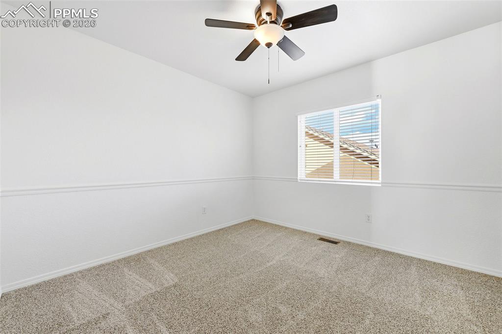Image 27 of 41: 3rd bedroom with new carpet, paint and walk-in closet