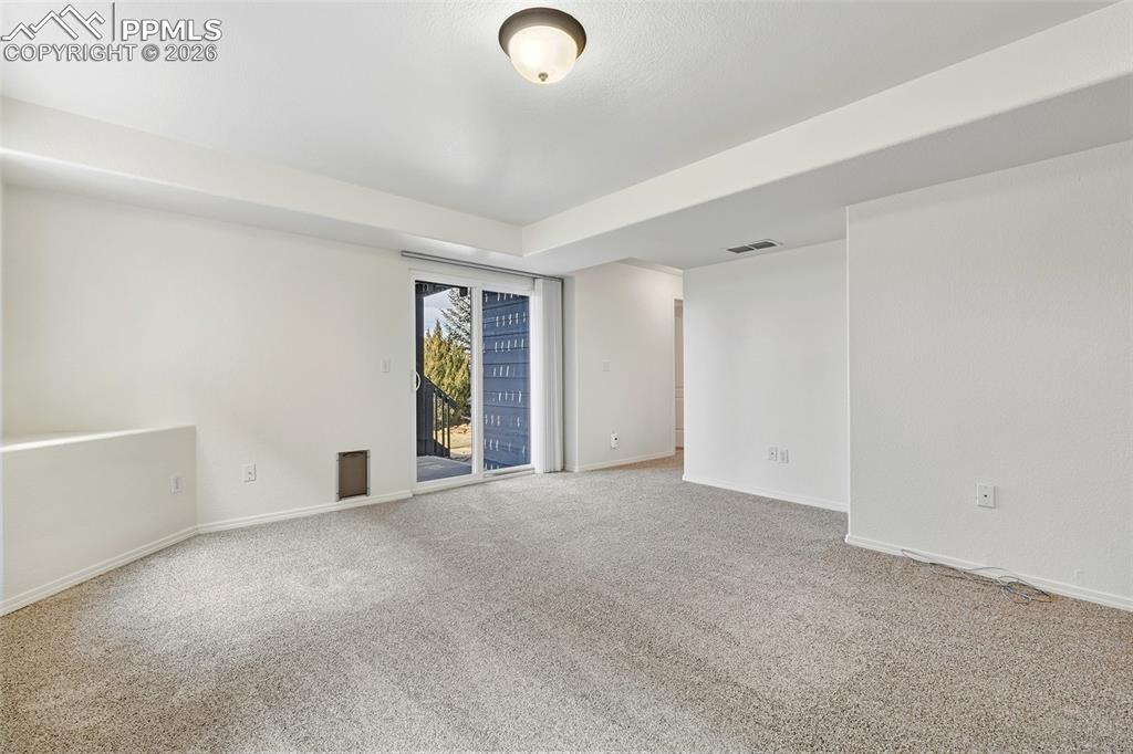 Image 28 of 41: Walk-out lower level family room