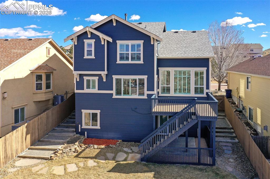 Image 39 of 41: Back View of Deck and wonderfully landscaped yard