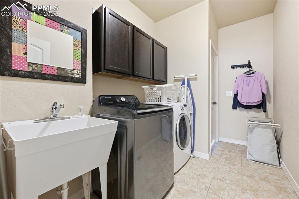 Image 24 of 41: Laundry connects to primary bedroom and mudroom