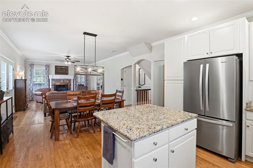 Image 12 of 40: Great room concept opens to the dining room and family room