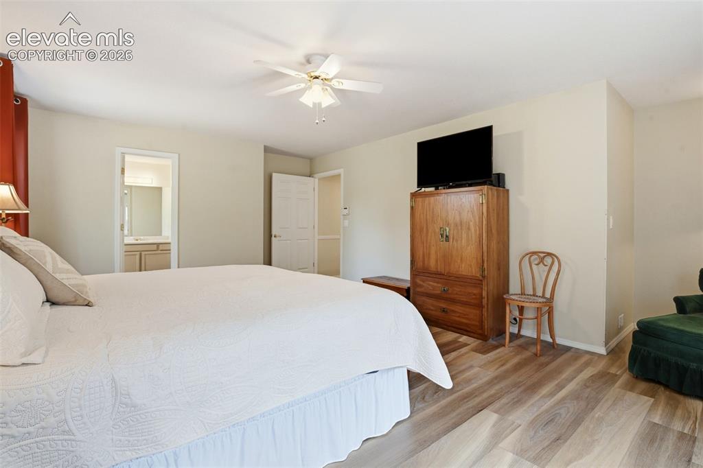 Image 22 of 40: Primary bedroom adjoins the primary bath and walk-in closet