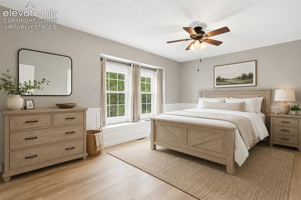Image 27 of 40: Virtually staged large secondary bedroom has a good sized walk-in closet an