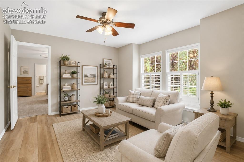 Image 30 of 40: Virtually staged upstairs sitting room (originally a bedroom) leads to the