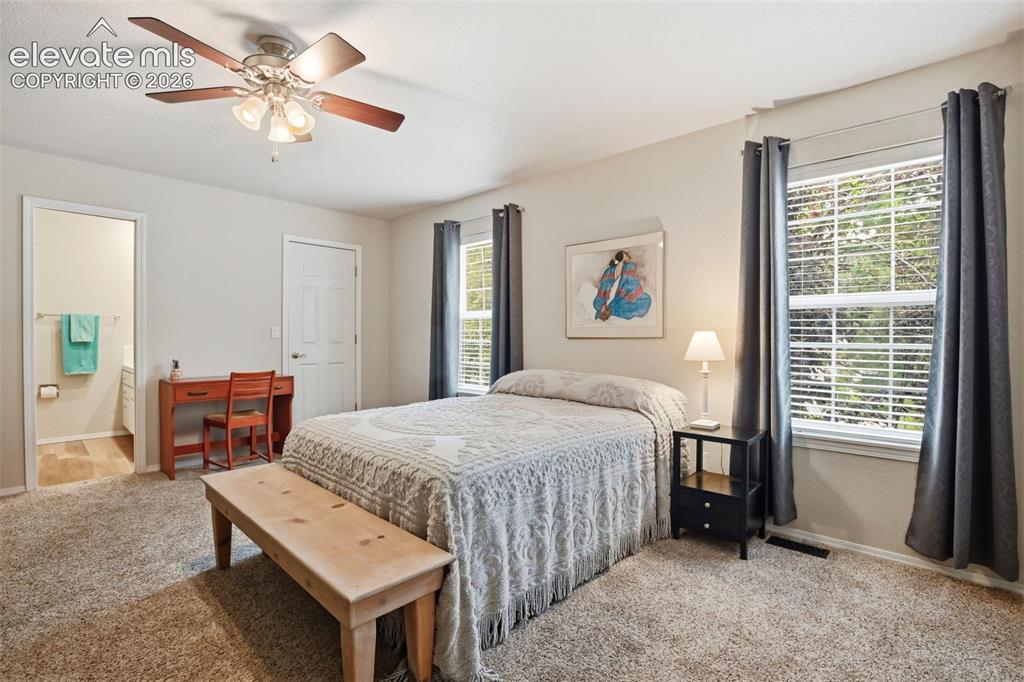 Image 32 of 40: Large upstairs bedroom addition with full ensuite bath and walk-in closet.