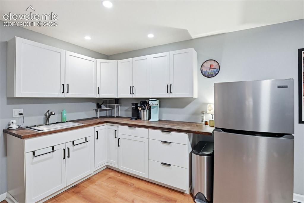 Image 34 of 40: Basement built-in kitchenette. Great multi-generational living opportunity.