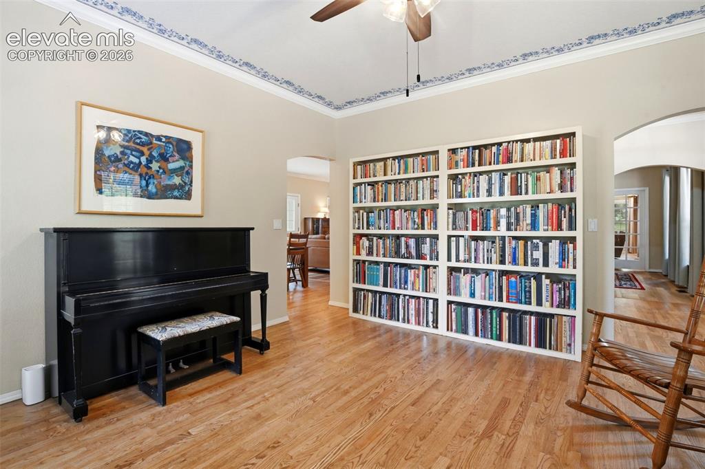 Image 4 of 40: Dining room - currently used as the music room/ Library - arched doorway o