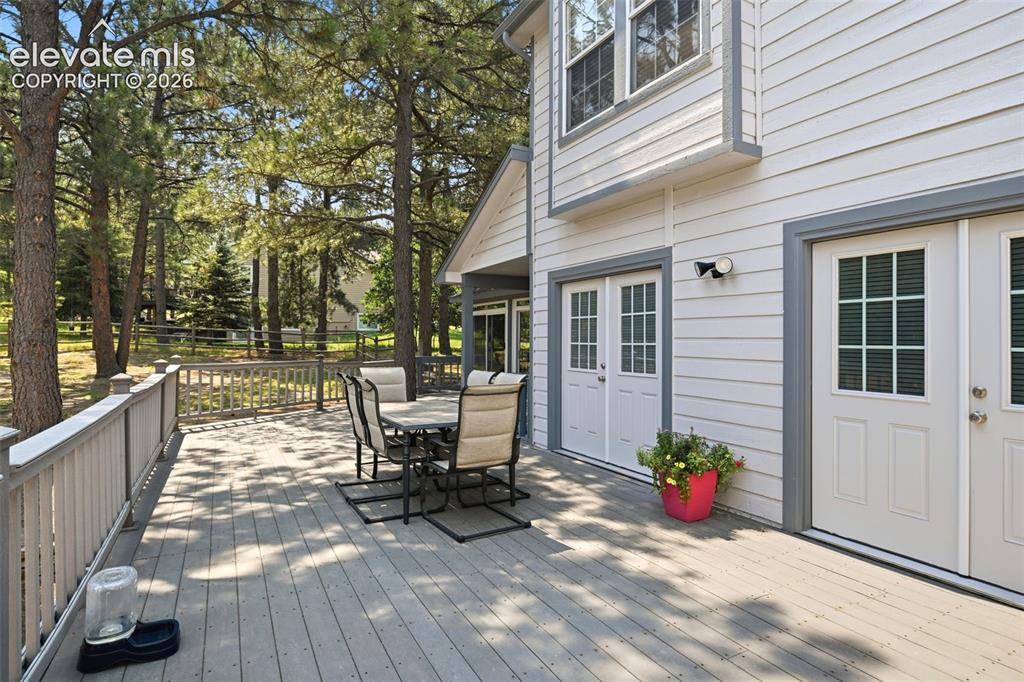 Image 41 of 44: Large outdoor deck with composite decking and white railings