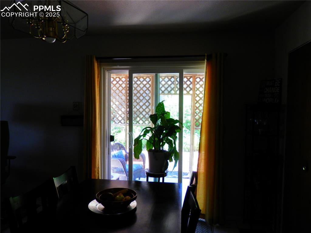 Image 10 of 29: Dining room featuring a chandelier