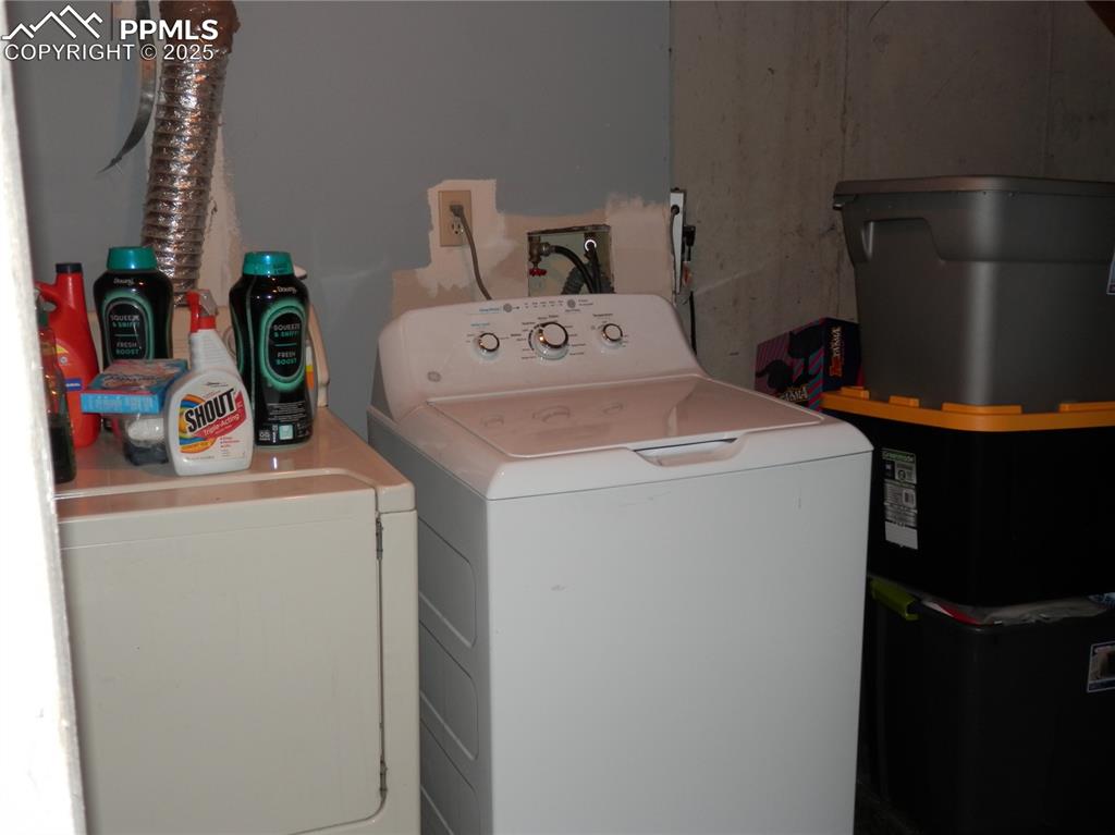 Image 24 of 29: Laundry area featuring washer and dryer