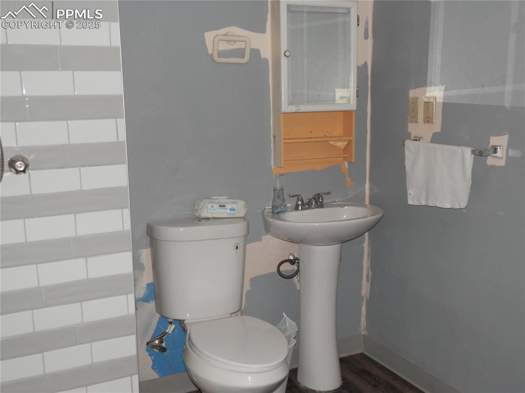 Image 29 of 29: Bathroom with toilet and a sink