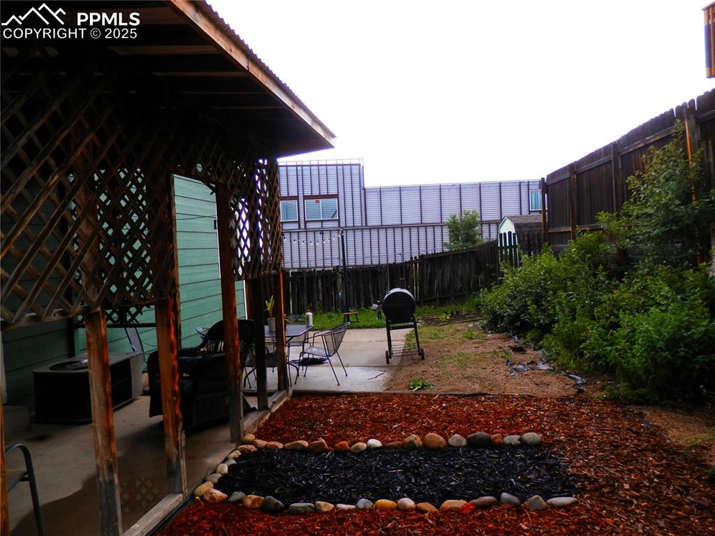 Image 5 of 29: View of yard with a patio area
