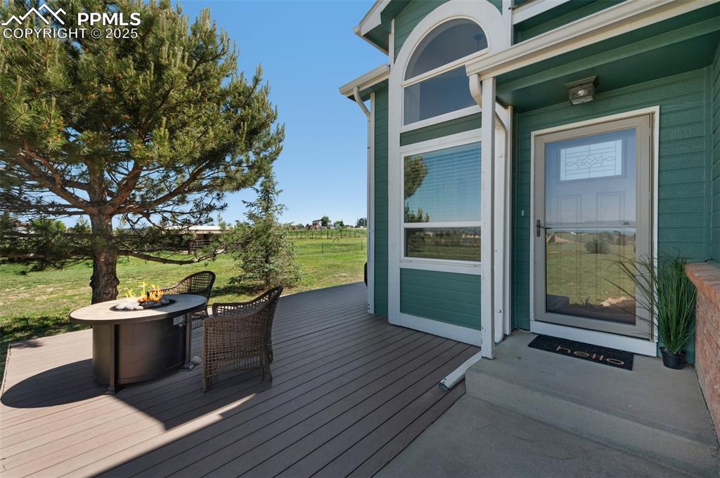 Image 49 of 50: Deck featuring an outdoor fire pit