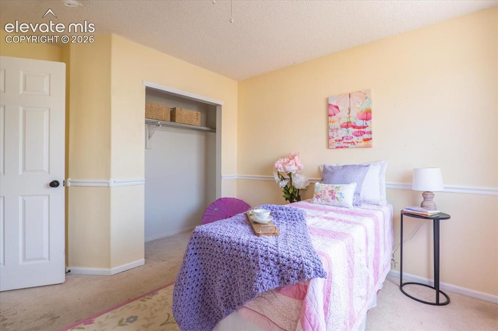Image 18 of 36: Guest room #2 with large walk-in closet