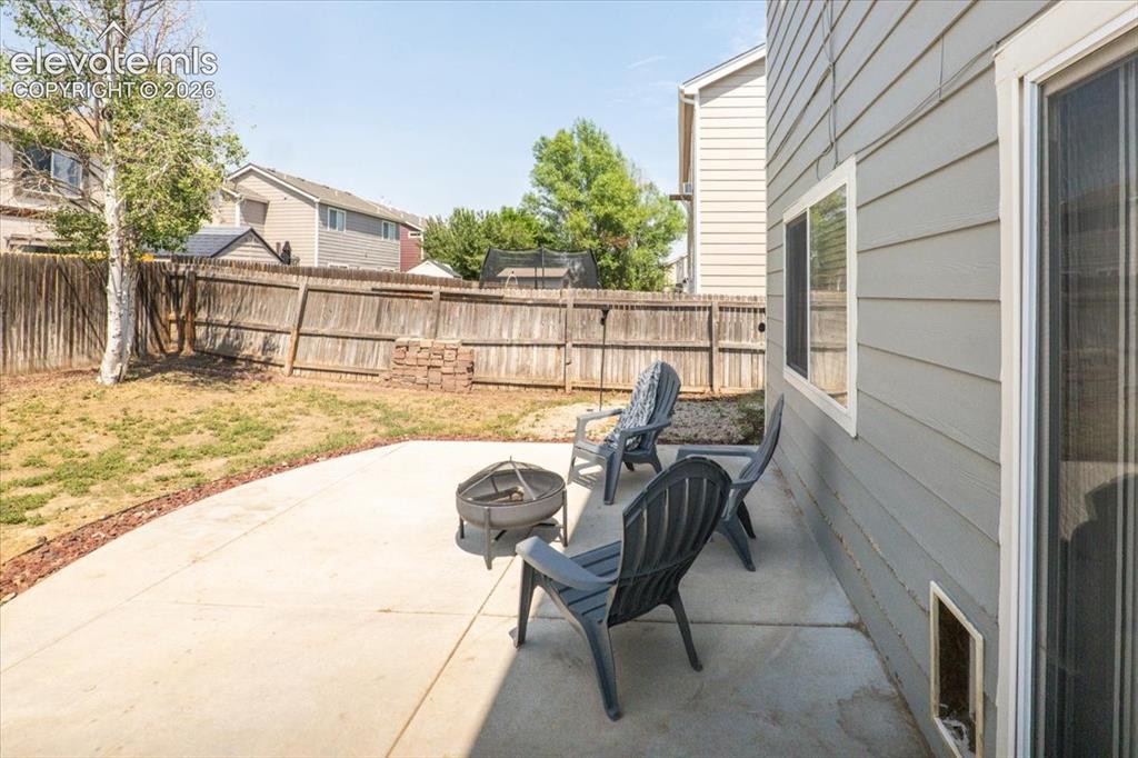 Image 27 of 36: Covered front porch of a 1,603 sq ft home with vaulted ceilings