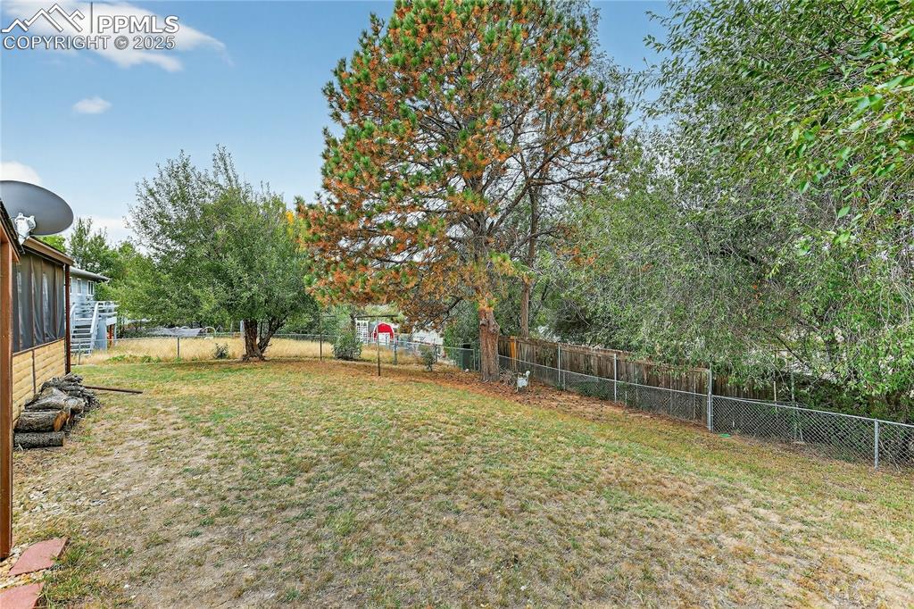 Image 13 of 15: Mature trees for backyard shade & privacy