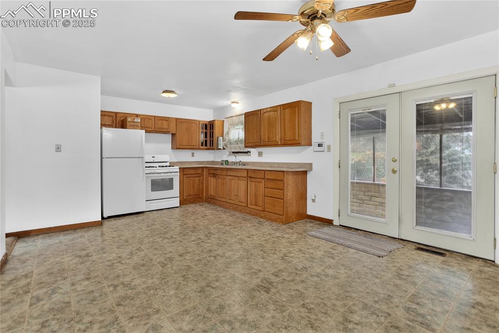 Image 4 of 15: Walk-out to enclosed patio