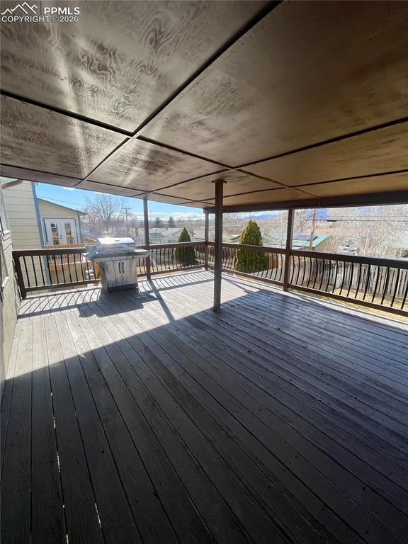 Image 27 of 29: Deck featuring grilling area and a residential view