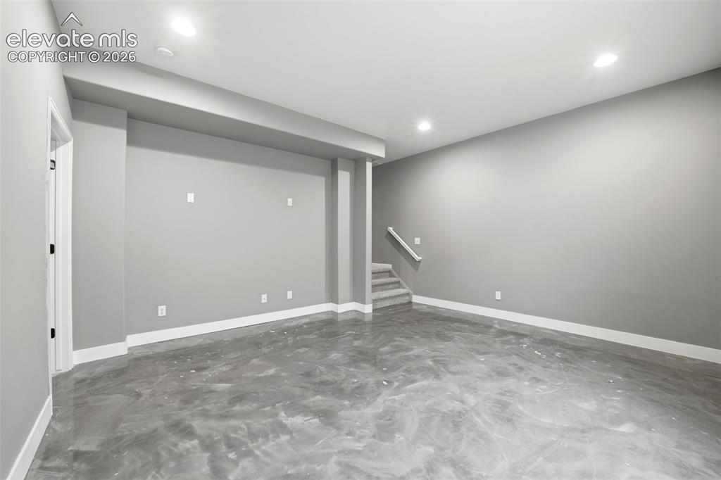 Image 23 of 29: Basement Flex Room Epoxy Floor