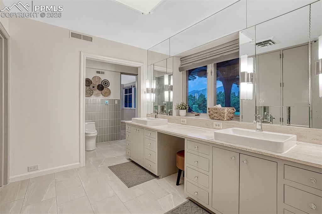 Image 14 of 46: Light and bright primary bathroom.