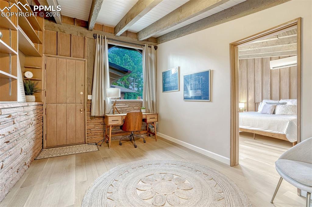 Image 18 of 46: Dedicated office with built ins and dutch door to front porch.