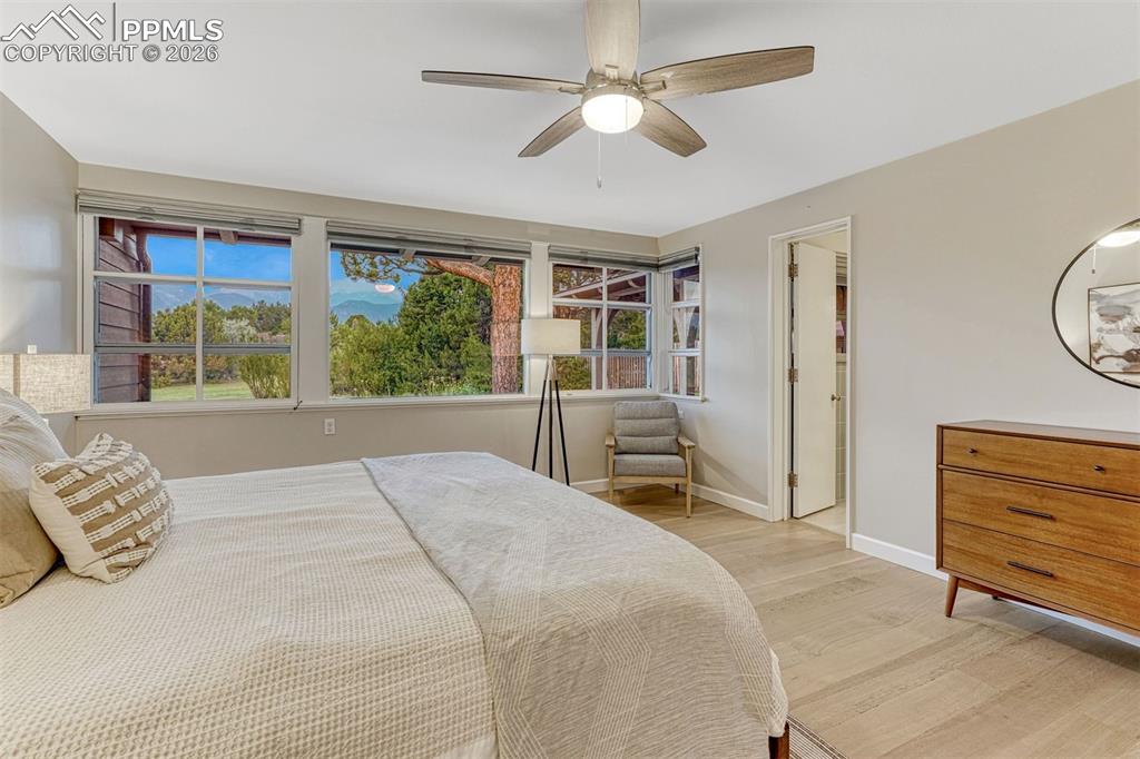 Image 27 of 46: A serene bedroom retreat with abundant natural light and timeless design.