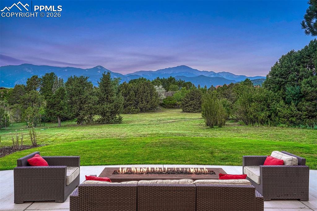 Image 38 of 46: Rectangular corden steel gas firepit on the expansive patio