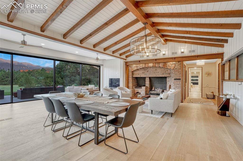 Image 6 of 46: An open dining area flowing into the living room, with breathtaking views i