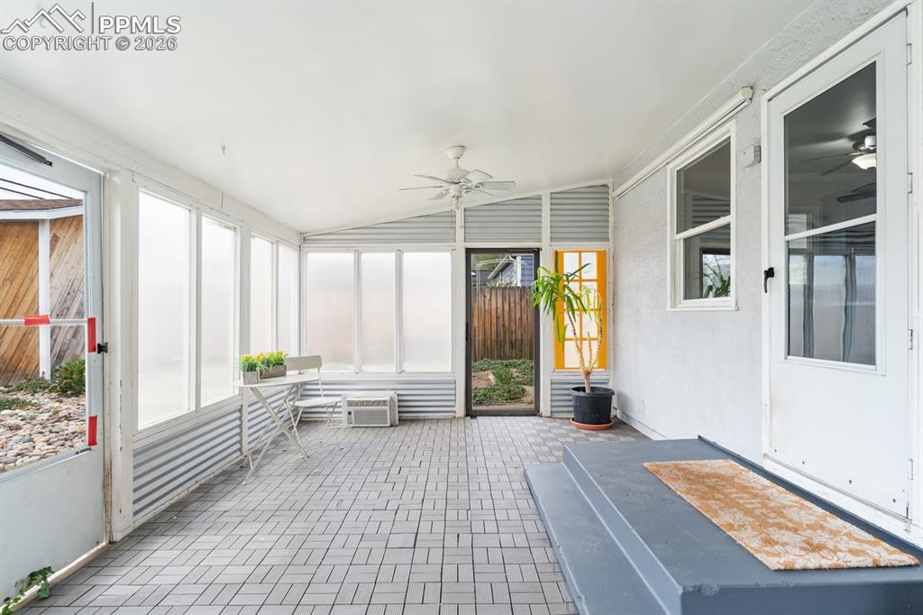 Image 20 of 32: This sun room offers great additional space with so many uses!