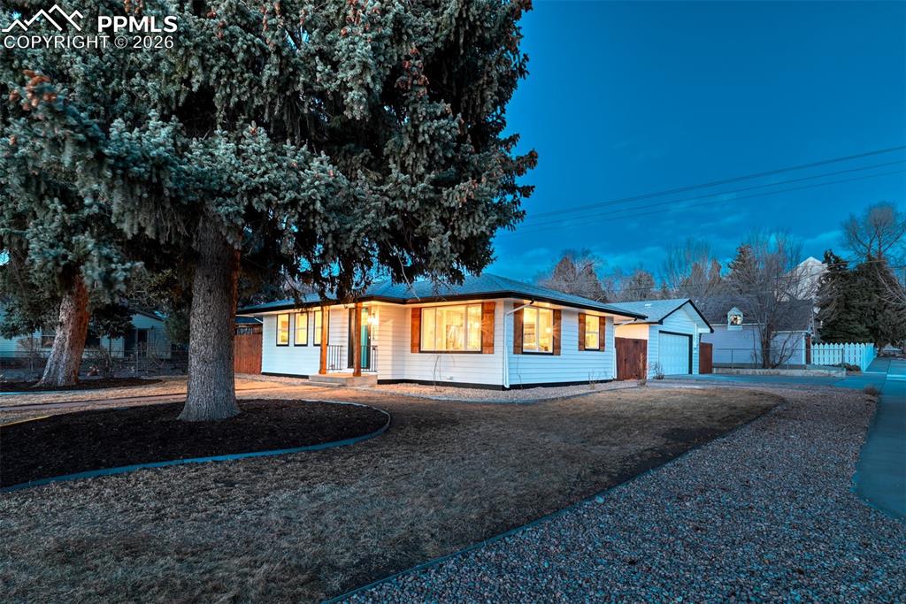 Image 33 of 35: Ranch-style house with a garage, an outdoor structure, and driveway
