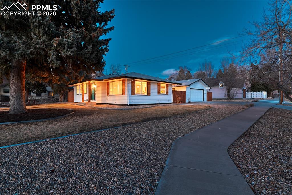Image 35 of 35: Single story home featuring a garage, driveway, and an outdoor structure