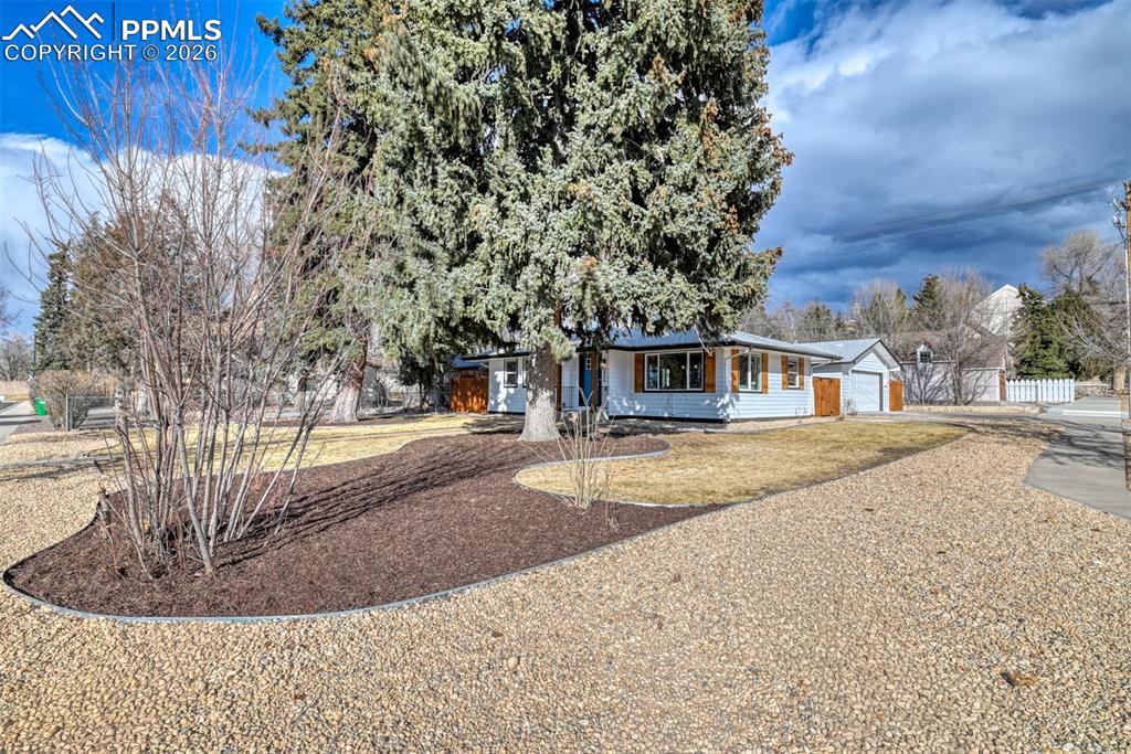 Image 6 of 30: Ranch-style home featuring driveway