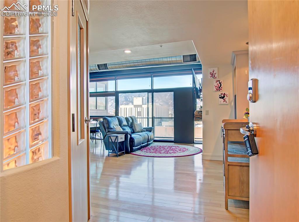 Image 4 of 20: Living area featuring light wood finished floors