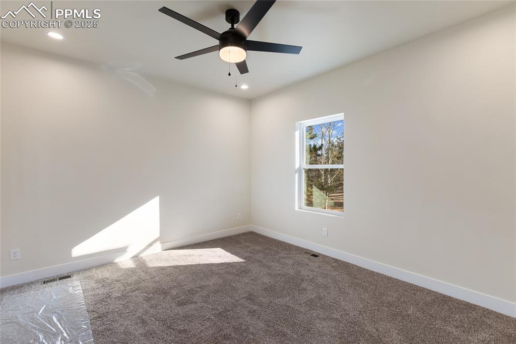 Image 9 of 38: Empty room featuring carpet, recessed lighting, and ceiling fan