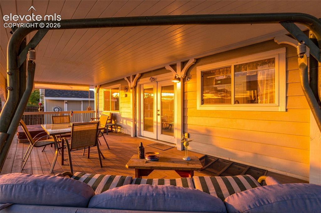 Image 23 of 41: Gorgeous, covered peaceful outdoor living area complete with Jacuzzi tub. E