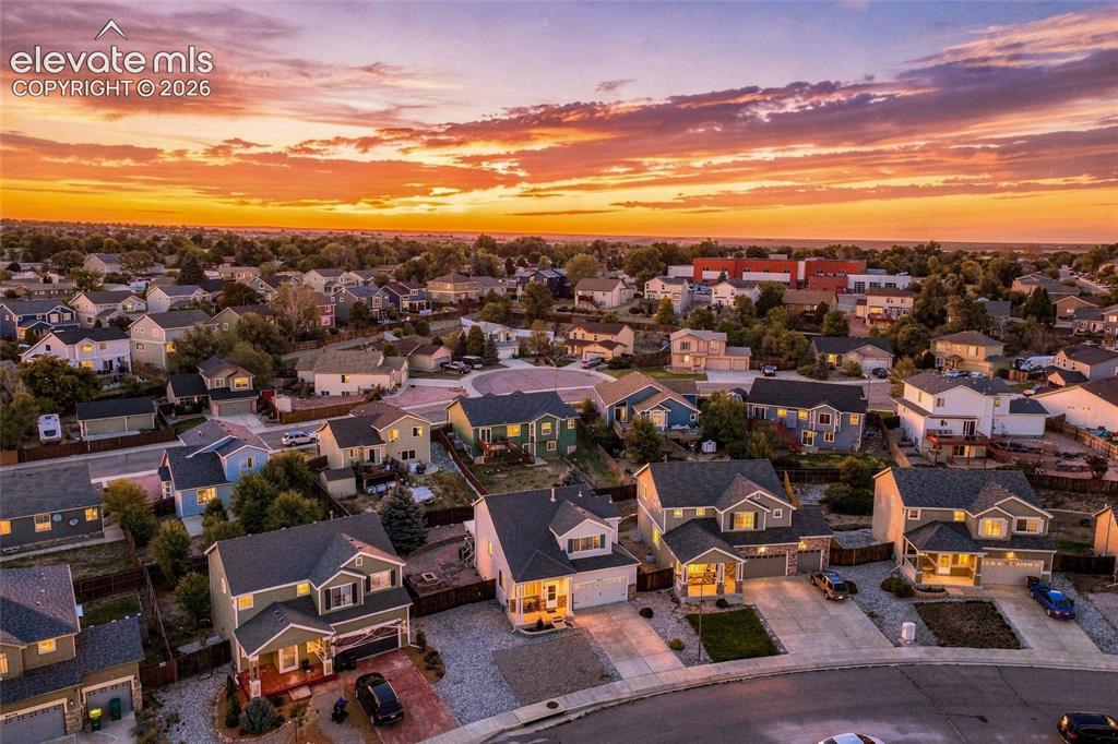 Image 32 of 41: Residential neighborhood with varied architectural styles and mature landsc