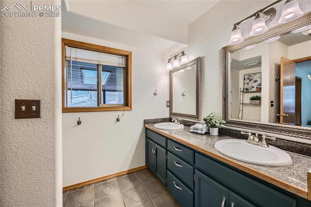 Image 19 of 37: Primary en-suite with double vanity