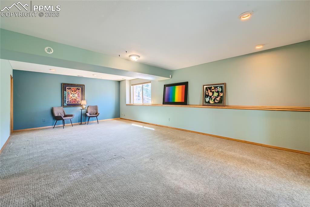 Image 25 of 37: Lower level family room, ideal for office space, man-cave, entertainment ce