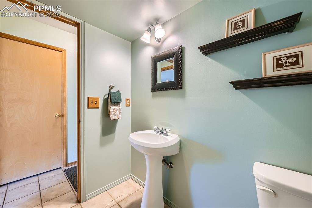 Image 26 of 37: Lower level guest bath