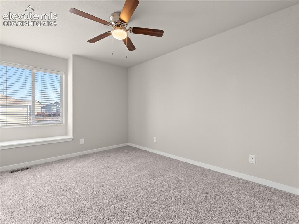 Image 35 of 46: Carpeted room featuring light gray walls, a window with blinds, and a ceili